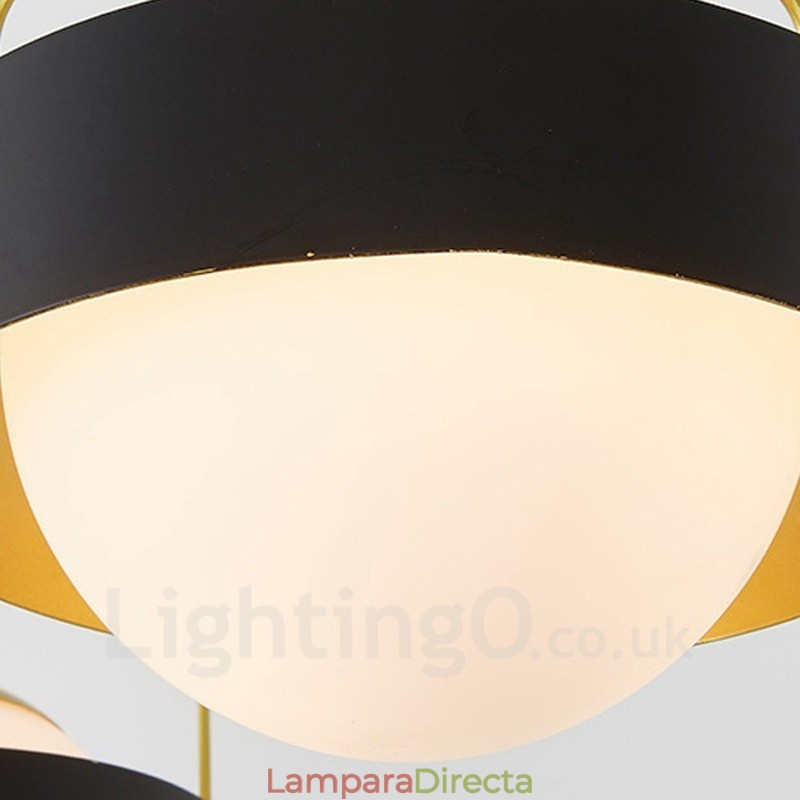 Lámpara de techo moderna contemporánea de 3 luces con baño de cobre y pantalla de cristal esférico blanco y negro.