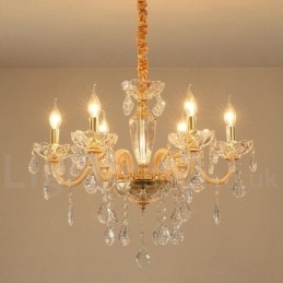 Candelabro dorado con candelabro de cristal transparente