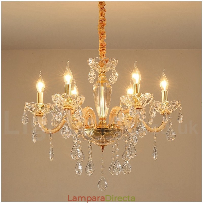 Candelabro dorado con candelabro de cristal transparente