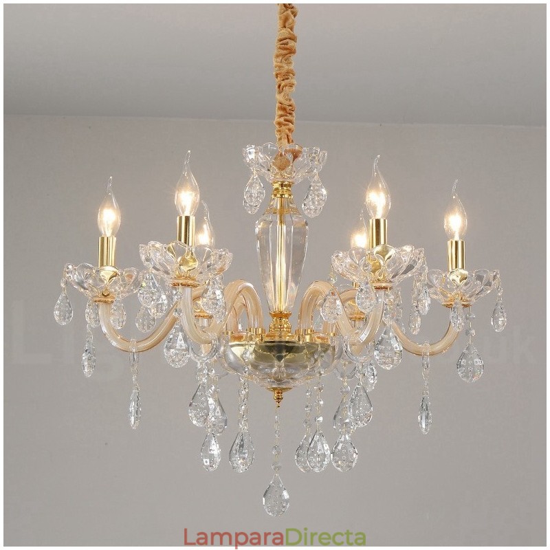 Candelabro dorado con candelabro de cristal transparente