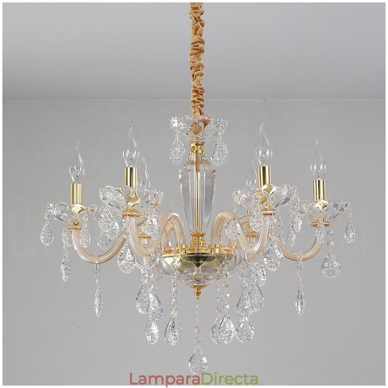 Candelabro dorado con candelabro de cristal transparente