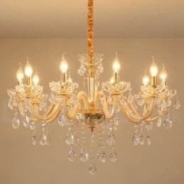 Candelabro dorado con candelabro de cristal transparente