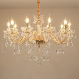 Candelabro dorado con candelabro de cristal transparente