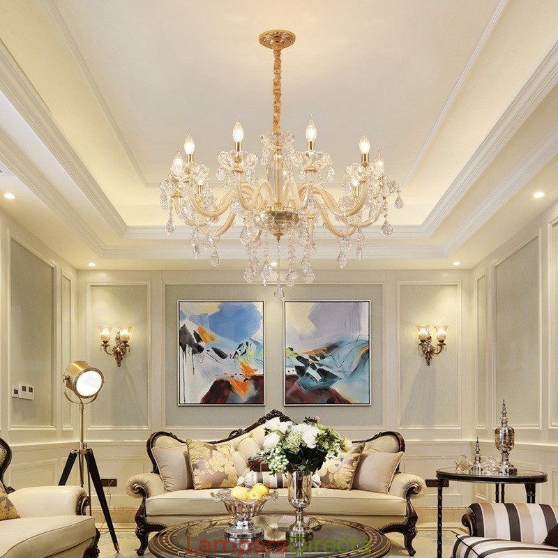 Candelabro dorado con candelabro de cristal transparente