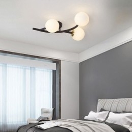 Lámpara de techo moderna minimalista con forma de rama y globo de cristal
