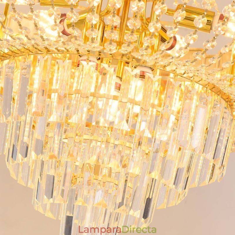 Lámpara colgante de cristal dorado, elegante y decorativa.