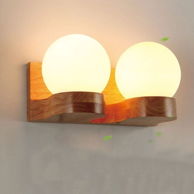 Lámpara de pared nórdica de madera maciza con forma de bola acogedora