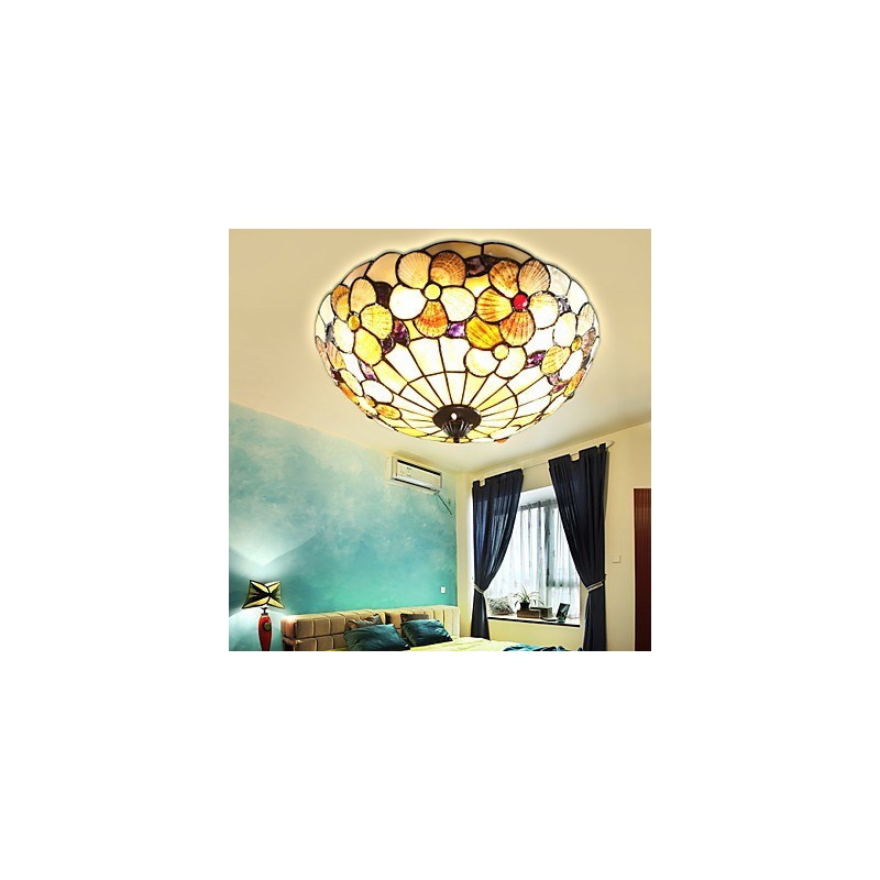 Chimenea rural de 50 cm de diámetro con conchas marinas mediterráneas que absorben la luz de la cúpula.
