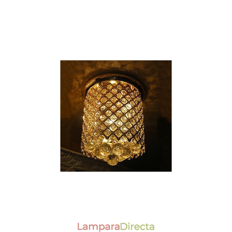Lámpara de techo moderna de cristal con acabado dorado y forma espiral.