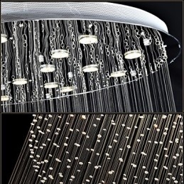 Lámpara colgante moderna de cristal de 12 luces con dosel plateado y globo de cristal transparente.